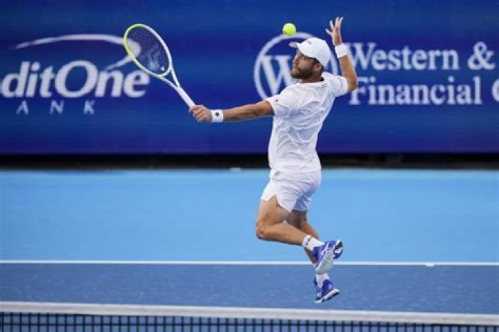 Who is Corentin Moutet’s coach Laurent Raymond?